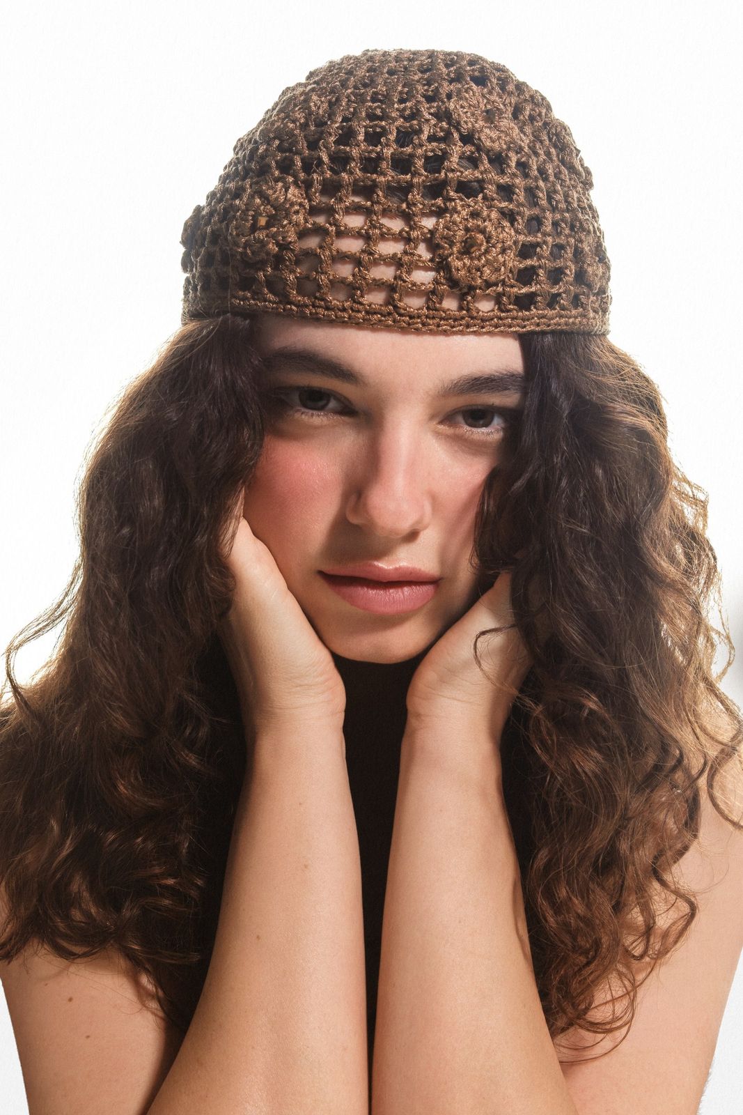 Beauty portrait in a crochet hat